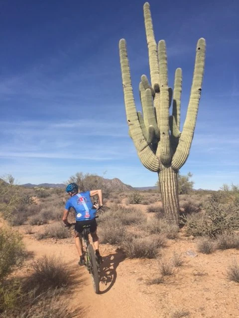 There are lots of cactus around. Vincent can&rsquo;t seem to keep both hands on the bars much.